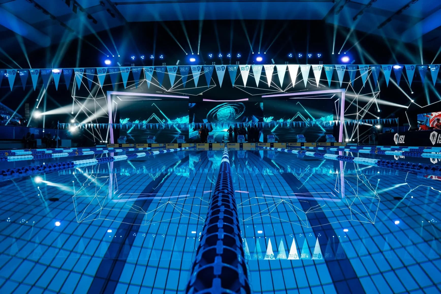 ISL competition pool with lane ropes, starting blocks and illuminated event staging