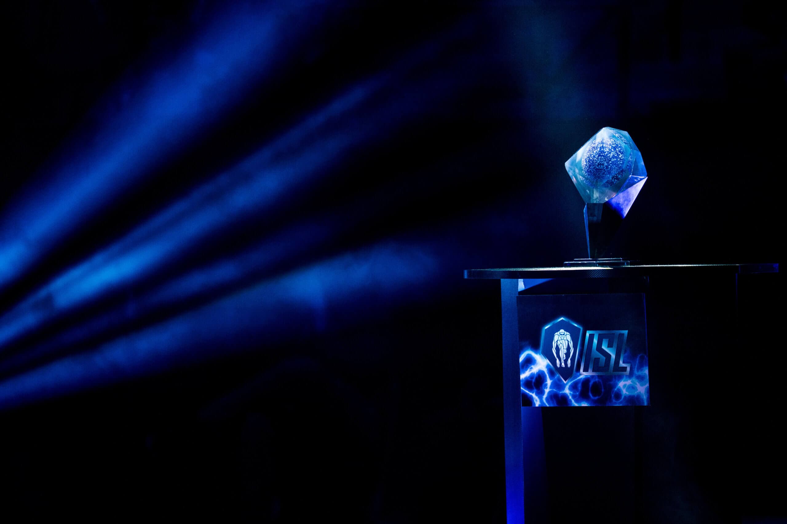 The ISL championship trophy under a spotlight
