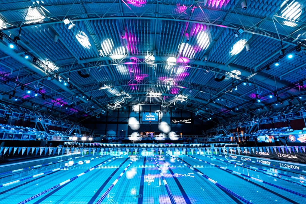 An ISL arena bathed in blue light before the session