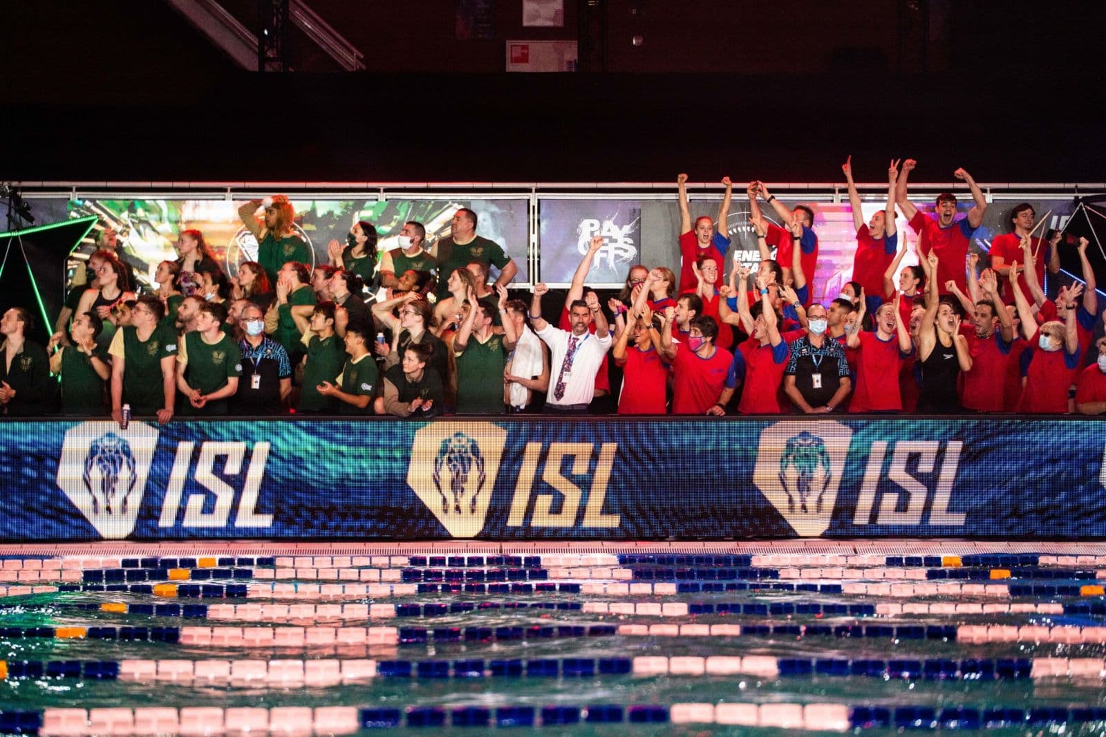 ISL athletes celebrating with their team poolside